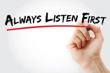 Hand writing Always Listen First with marker, concept background