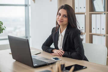 Business woman with notebook in office, workplace