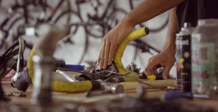 Close up of man is repairing a bike