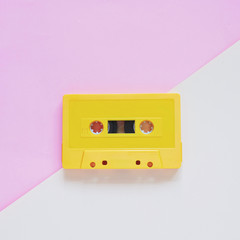 Retro cassette tape on pastel color background, minimal style