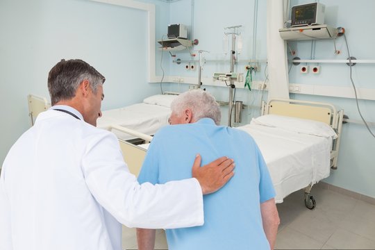 Composite image of doctor taking care of a mature man