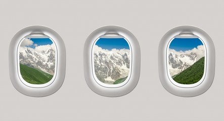 Looking out the windows of a plane to the mountains in Georgia