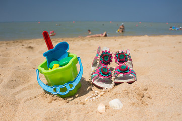 Toys for childrens sandboxes against the sea and the beach