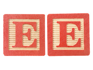 red playing cubes with alphabet e.