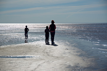 Silhouette of happy children and mother