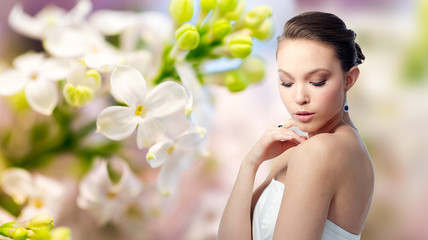 beautiful woman with earring, ring and pendant