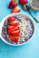  Oatmeal porridge with strawberry slices and chia seeds