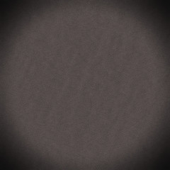 dark grainy background with circular vignette