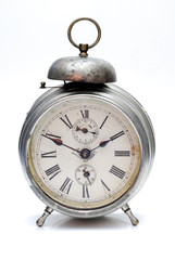 Old alarm clock isolated on white background
