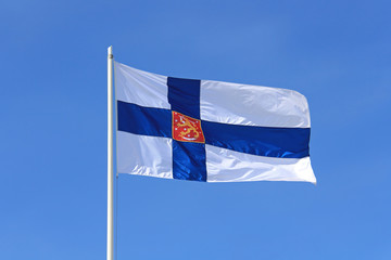 Finland State Flag against Blue Sky