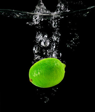 Citrus Lime falling into the water