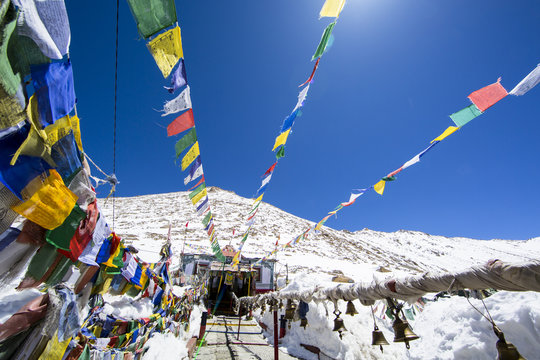 rayer flags at Changla Pass. It is the third highest motorable road in the world (5,360 m) on the route to Pangong Lake from Leh, Ladakh, India.