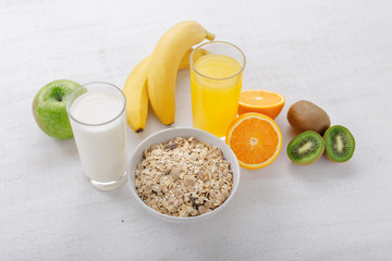 Granola with fruit, juice and milk