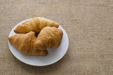 Three golden croissants