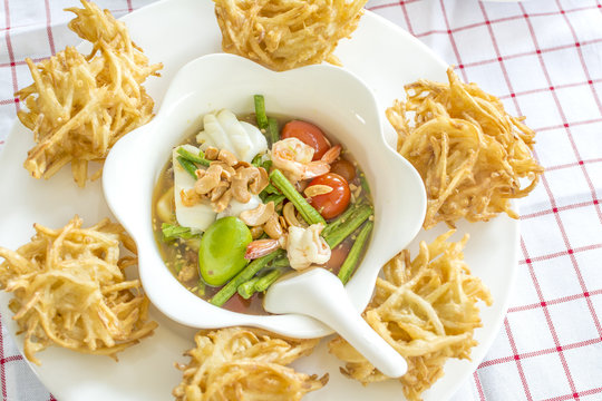 Papaya fried salad crispy famous and delicious Thai fusion food  what we called "Somtum" in Thai.