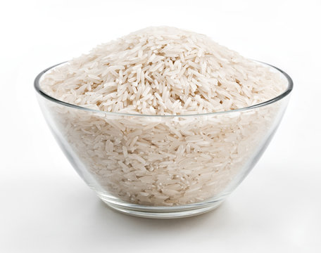 White rice in a glass bowl on white background. Close up, high resolution product.