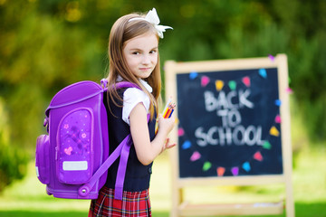 Adorable little girl feeling exited about going back to school