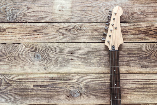 Grif guitar on the background of old grunge boards. Place for te