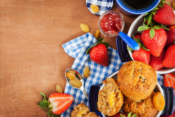 Obraz na płótnie Canvas Breakfast with muffins, jam, coffee and strawberry