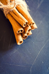 Bunch of cinnamon sticks on black background
