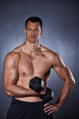 Man holding a dumbbell doing a fitness workout