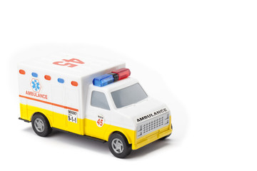 miniature ambulance on white background © Dan Kosmayer