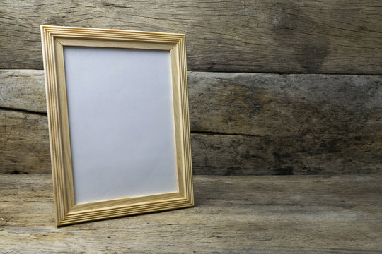 Wood photo frame on wooden table