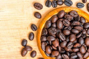Roasted Coffee Beans background texture on wood background