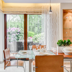 Modern style dining room with large windows
