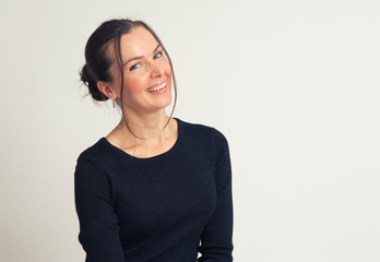 smiling brunette woman looking at camera