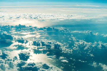 sea view through airplane window at high altitude.