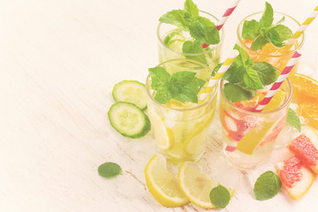 Summer drinks water with ice, mint and citrus, copy space, tinte