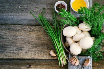 bowl with mushrooms, herbs and spices on an old background, spac