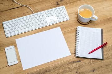 Workplace with various supplies and blank space