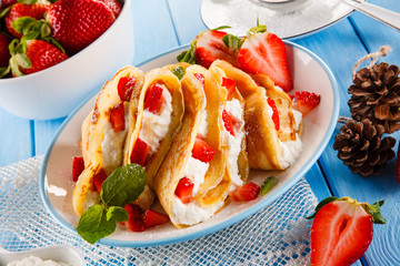 Crepes with strawberries and cream 