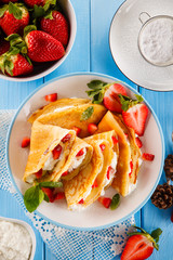 Crepes with strawberries and cream 