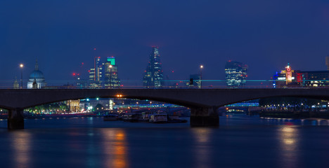 London cityscape at night including St, Paul’s Cathedral and Waterloo Bridge