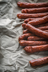 Many smoked sausage Chorizo on a background of paper