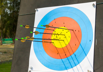 Arrow hit goal ring in archery target.