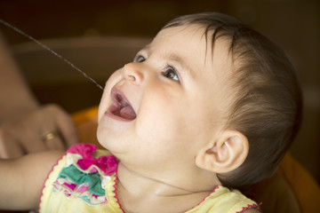 Close-up of baby drinking water