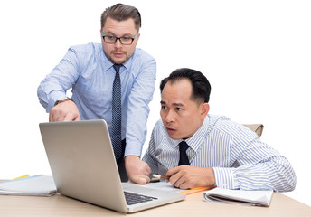 Two business people point finger on laptop isolated