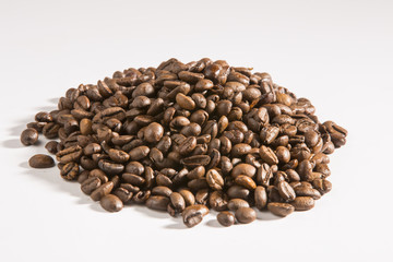 roasted coffee beans on white background