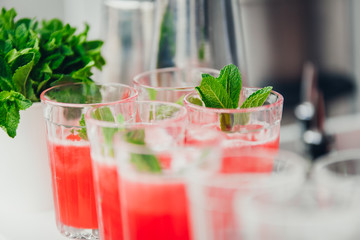refreshing fruit punch beverage in glass on wooden background