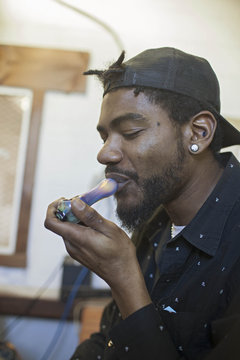 Portrait of a young man smoking.