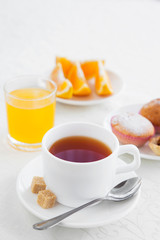 Morning coffee and fresh pastries with orange juice