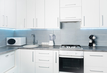 modern white kitchen in minimalism style, frontal view