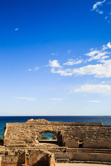 Tarragona Amphitheatre with blue sky in background.