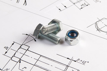 Engineering drawings and metal bolt. Science, mechanics and mechanical engineering.