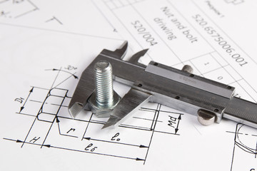 Engineering drawings, metal bolt and caliper. Science, mechanics and mechanical engineering.