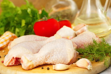 Raw chicken with vegetables and spices before cooking